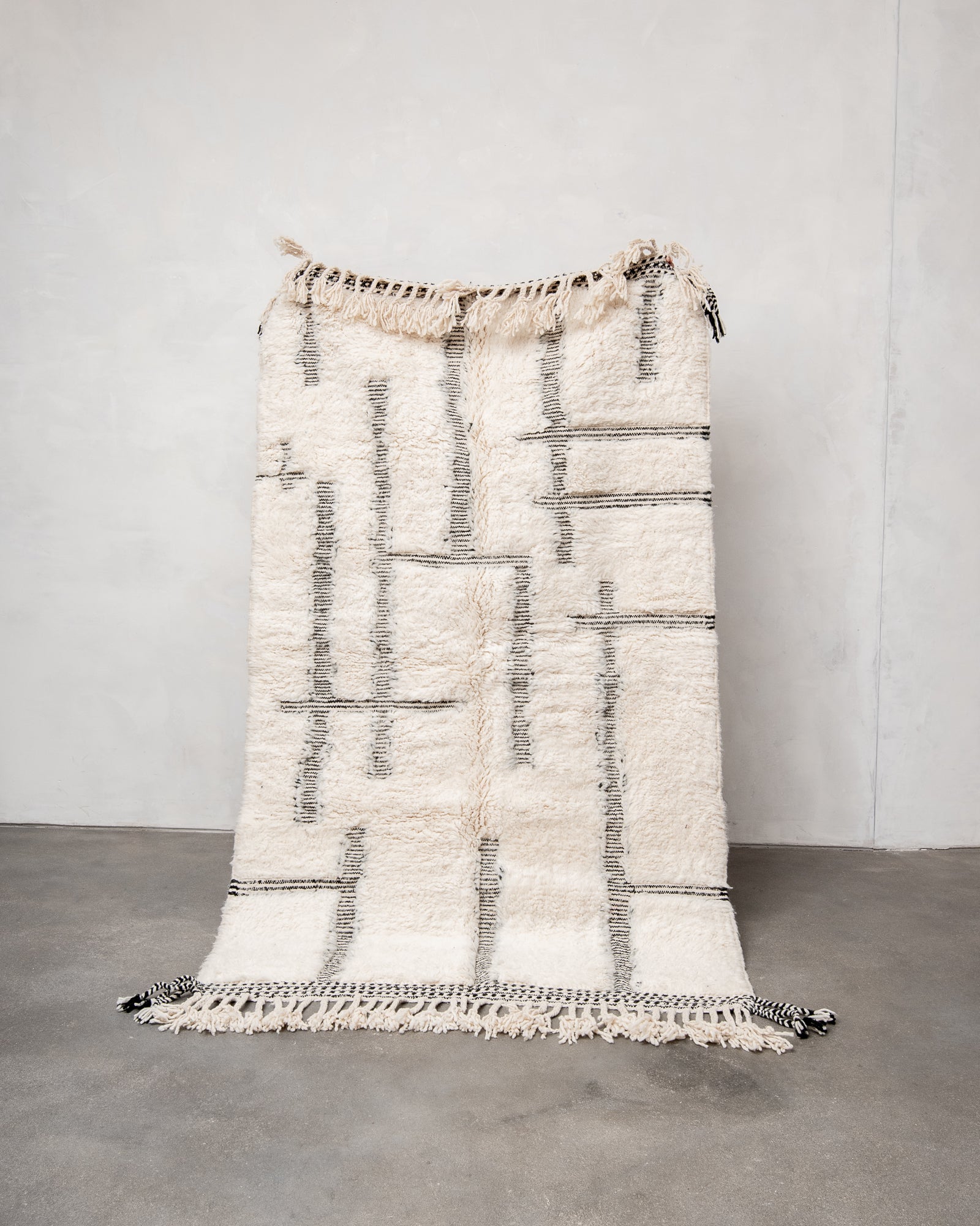 Modern, designer, handcrafted Berber rug from Morocco. Beniourain carpet with beautiful colours and patterns and fluffy wool texture.